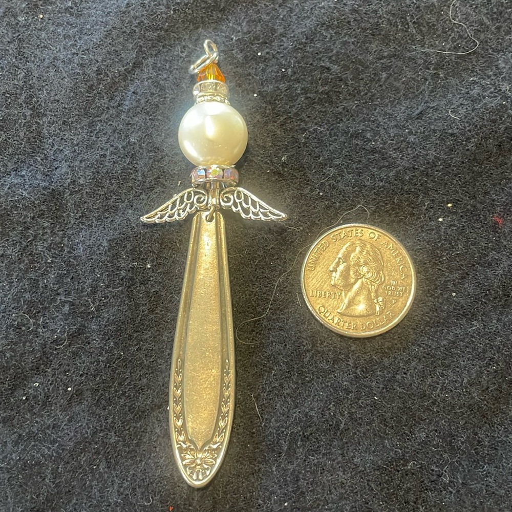 Handmade ornate silver angel pendant/ornament.